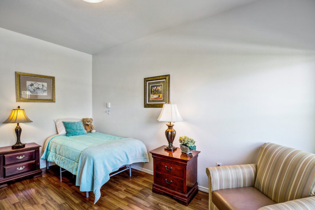 Bedroom with single bed and chair