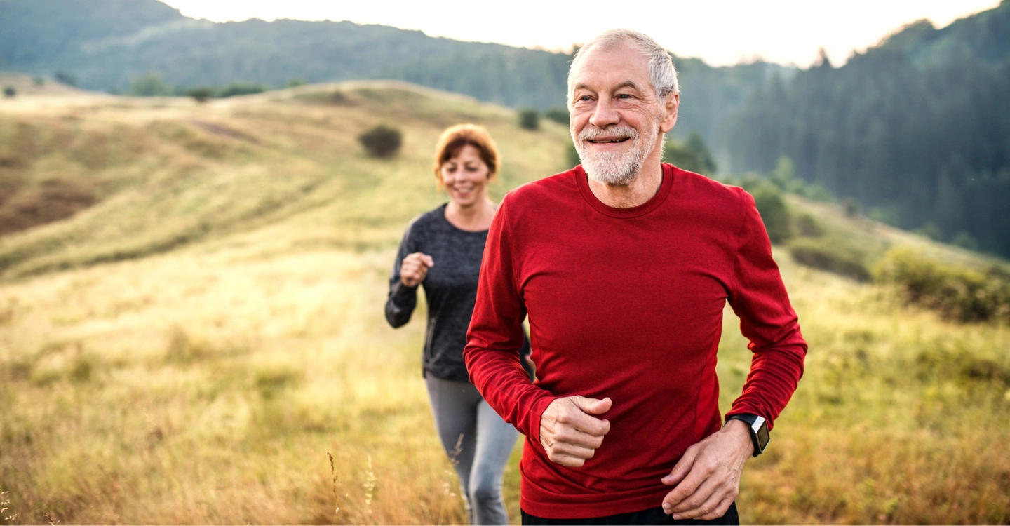 A man in a red shirt goes on a hike